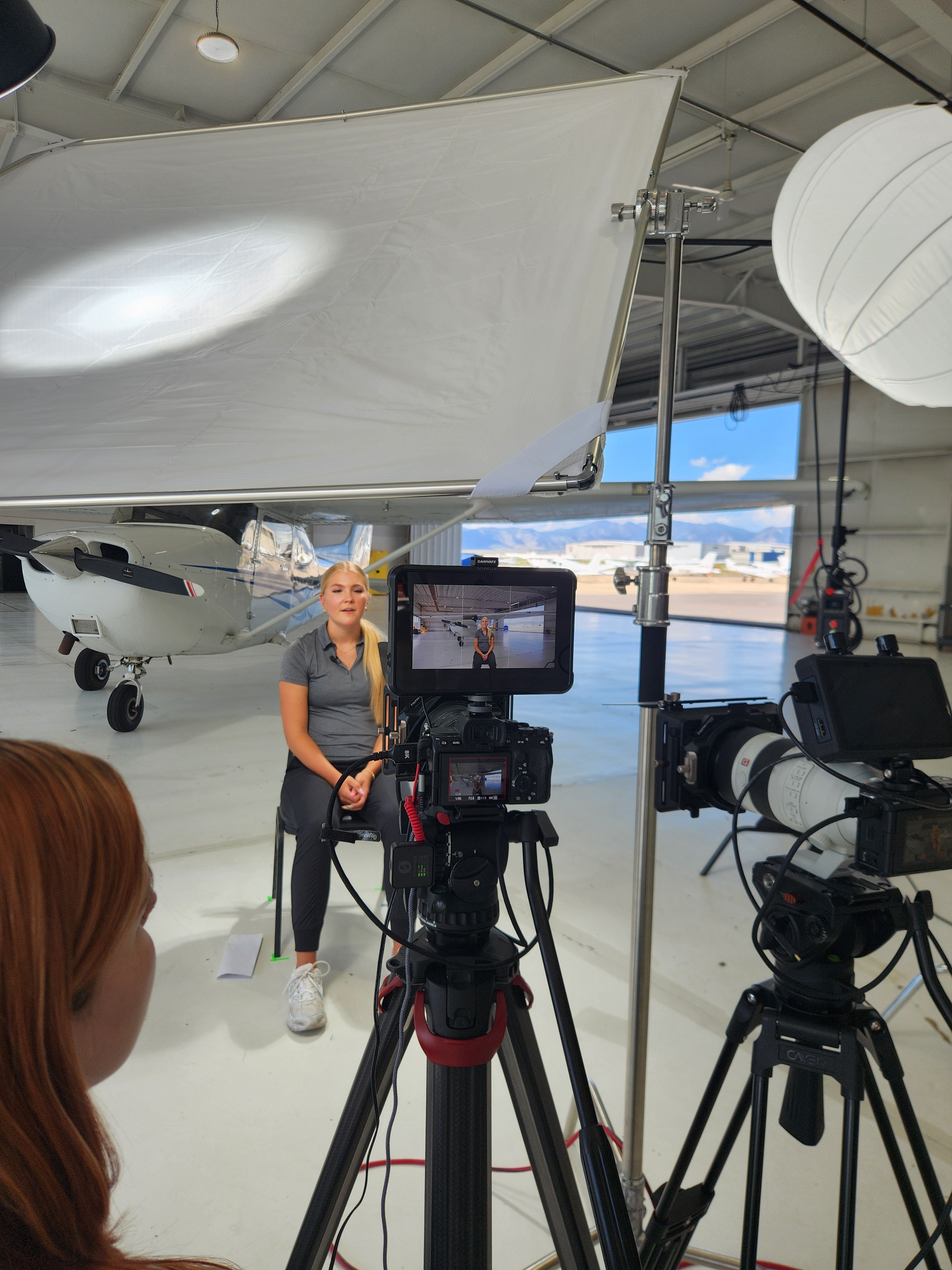 Pidoxa production team shooting an interview in an aircraft hangar